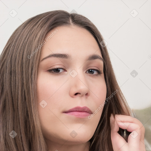 Neutral white young-adult female with long  brown hair and brown eyes