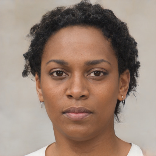 Neutral black young-adult female with short  brown hair and brown eyes