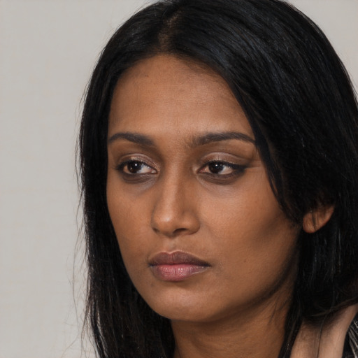 Neutral black young-adult female with long  black hair and brown eyes
