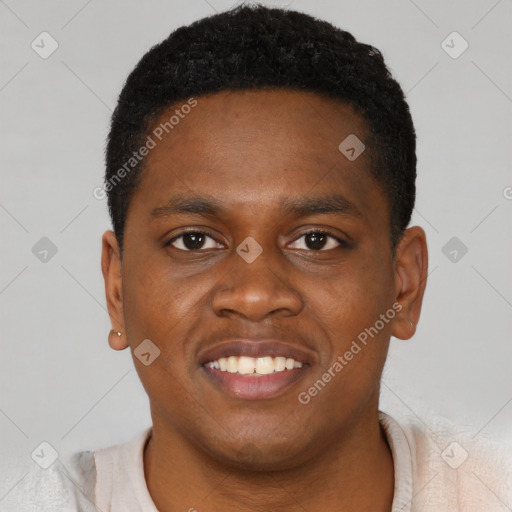 Joyful black young-adult male with short  brown hair and brown eyes