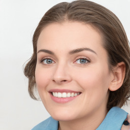 Joyful white young-adult female with medium  brown hair and blue eyes