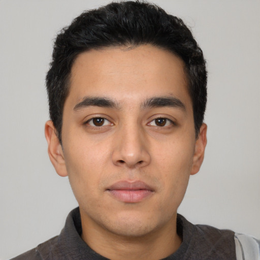 Neutral latino young-adult male with short  black hair and brown eyes