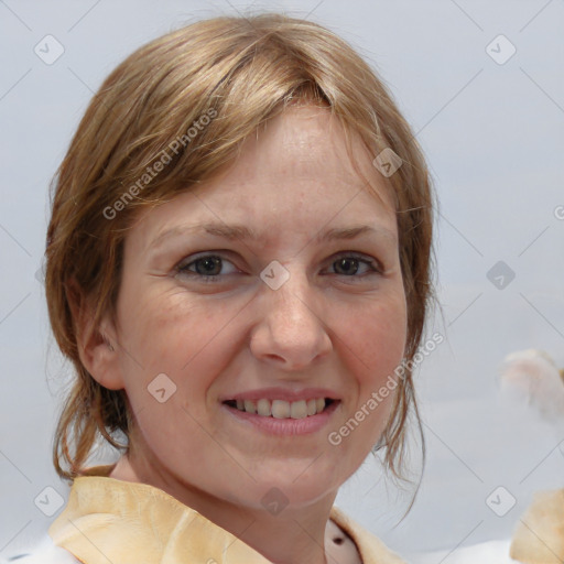 Joyful white adult female with medium  brown hair and grey eyes