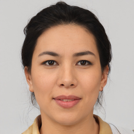 Joyful asian young-adult female with medium  brown hair and brown eyes