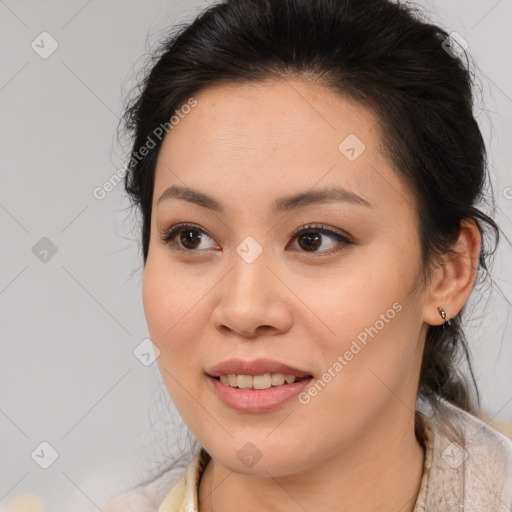 Joyful latino young-adult female with medium  brown hair and brown eyes