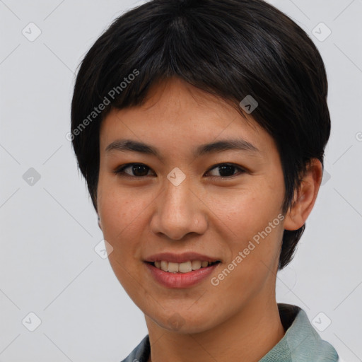 Joyful asian young-adult female with short  black hair and brown eyes