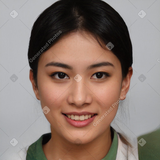 Joyful asian young-adult female with short  brown hair and brown eyes