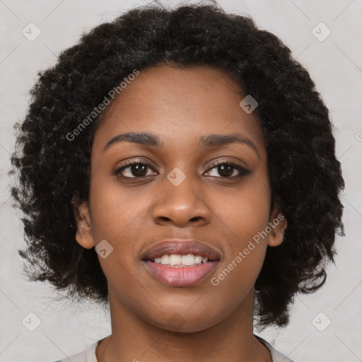 Joyful black young-adult female with long  brown hair and brown eyes