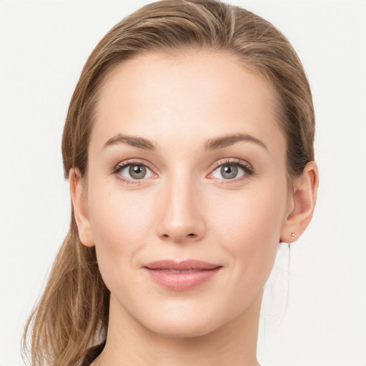 Joyful white young-adult female with long  brown hair and grey eyes