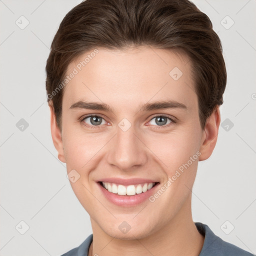 Joyful white young-adult female with short  brown hair and grey eyes