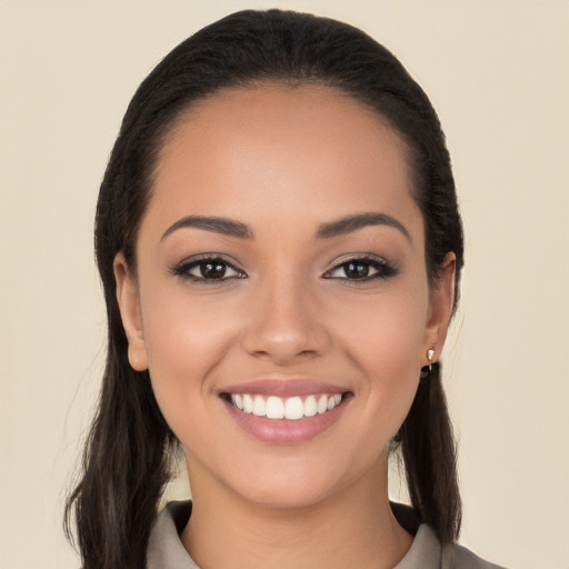 Joyful white young-adult female with long  black hair and brown eyes