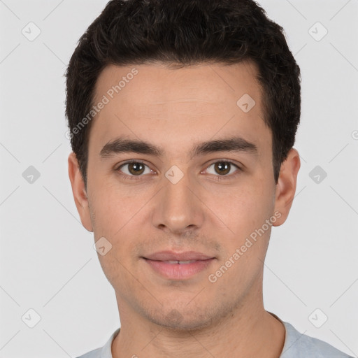 Joyful white young-adult male with short  black hair and brown eyes