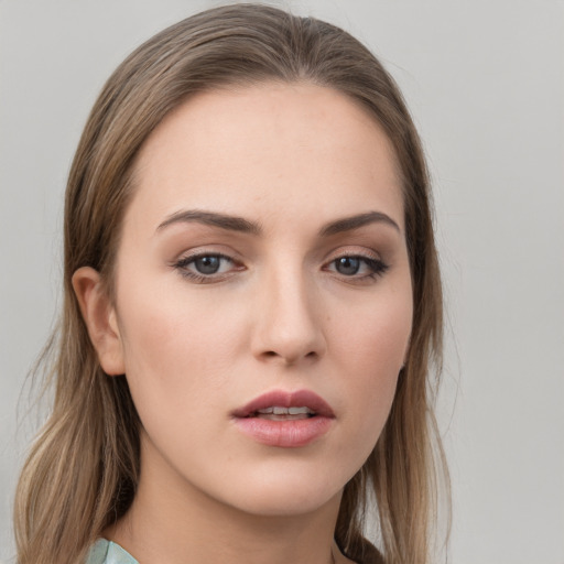 Neutral white young-adult female with long  brown hair and grey eyes