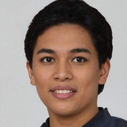 Joyful asian young-adult male with short  black hair and brown eyes