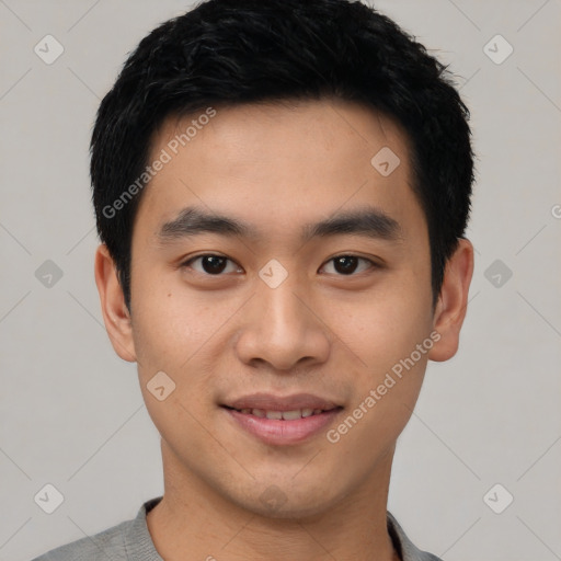 Joyful asian young-adult male with short  black hair and brown eyes