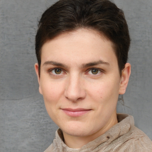 Joyful white young-adult female with short  brown hair and grey eyes