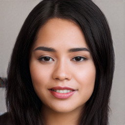 Joyful white young-adult female with long  black hair and brown eyes