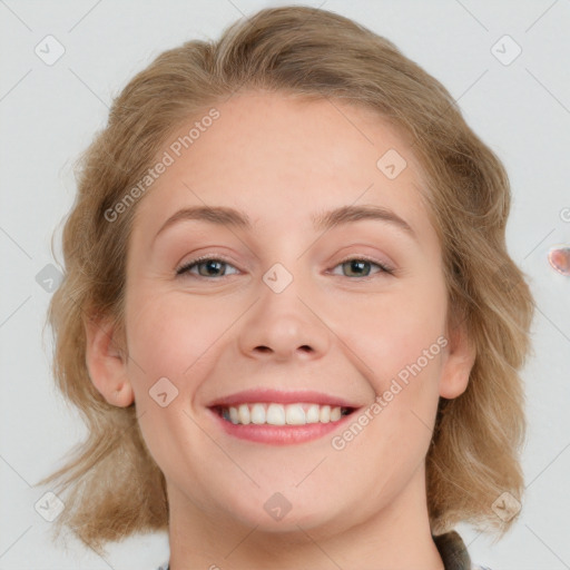 Joyful white young-adult female with medium  brown hair and blue eyes