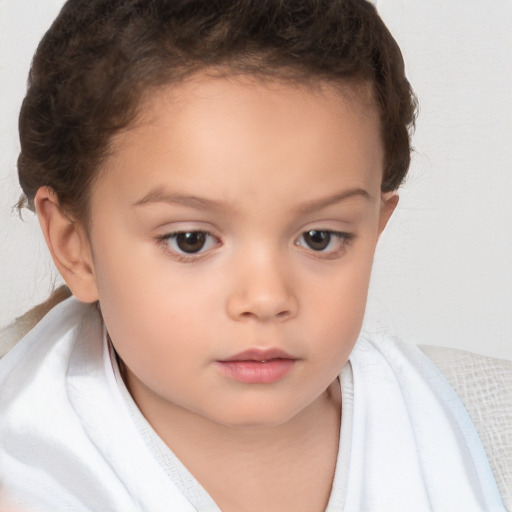 Neutral white child female with short  brown hair and brown eyes