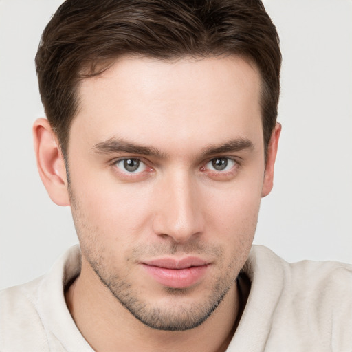 Neutral white young-adult male with short  brown hair and brown eyes