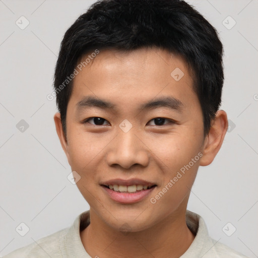 Joyful asian young-adult male with short  black hair and brown eyes