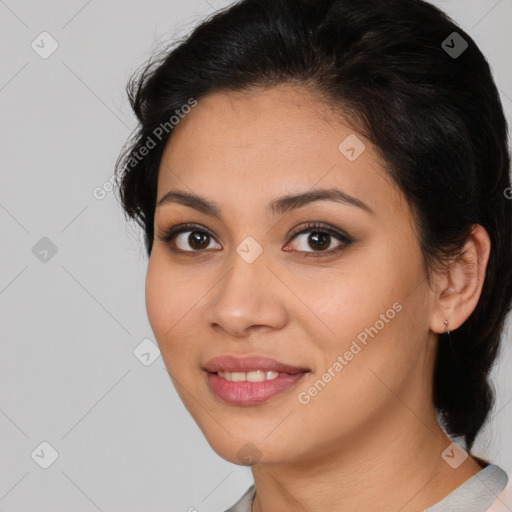 Joyful latino young-adult female with medium  brown hair and brown eyes