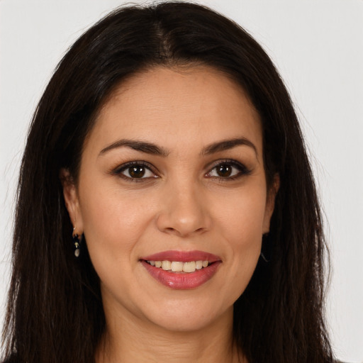 Joyful white young-adult female with long  brown hair and brown eyes