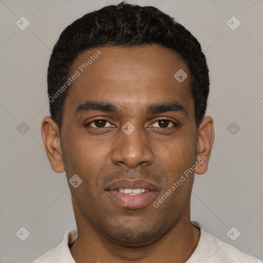 Joyful black young-adult male with short  black hair and brown eyes