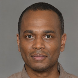 Neutral latino young-adult male with short  brown hair and brown eyes