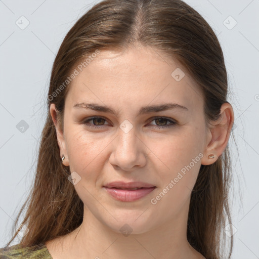 Joyful white young-adult female with long  brown hair and grey eyes