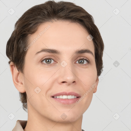 Joyful white young-adult female with short  brown hair and grey eyes