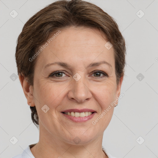 Joyful white adult female with short  brown hair and grey eyes