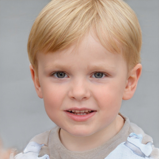 Joyful white child male with short  brown hair and blue eyes