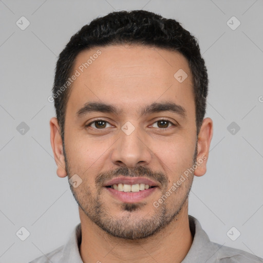 Joyful white young-adult male with short  black hair and brown eyes