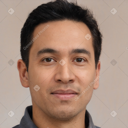 Joyful white young-adult male with short  black hair and brown eyes