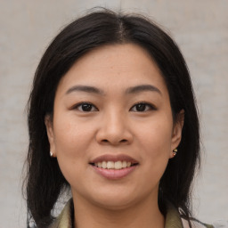 Joyful white young-adult female with medium  brown hair and brown eyes