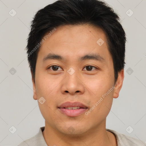 Joyful asian young-adult male with short  brown hair and brown eyes