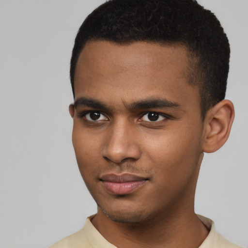 Joyful latino young-adult male with short  brown hair and brown eyes