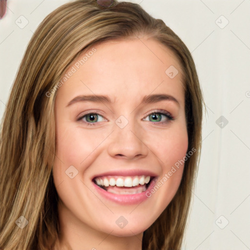 Joyful white young-adult female with long  brown hair and blue eyes