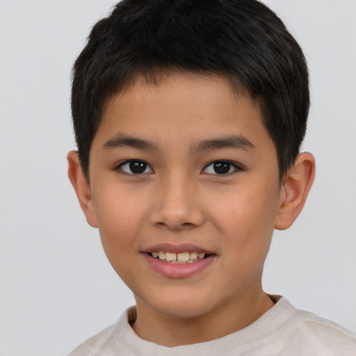 Joyful white child male with short  brown hair and brown eyes