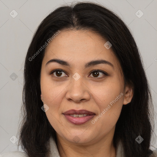 Joyful white adult female with long  brown hair and brown eyes