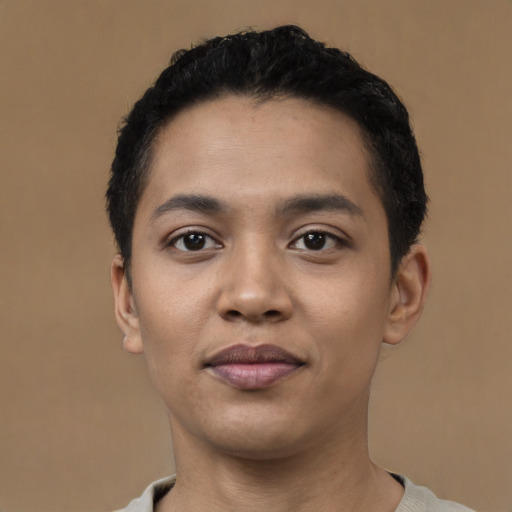 Joyful latino young-adult male with short  black hair and brown eyes