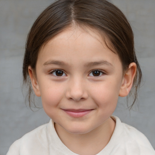 Joyful white child female with medium  brown hair and brown eyes