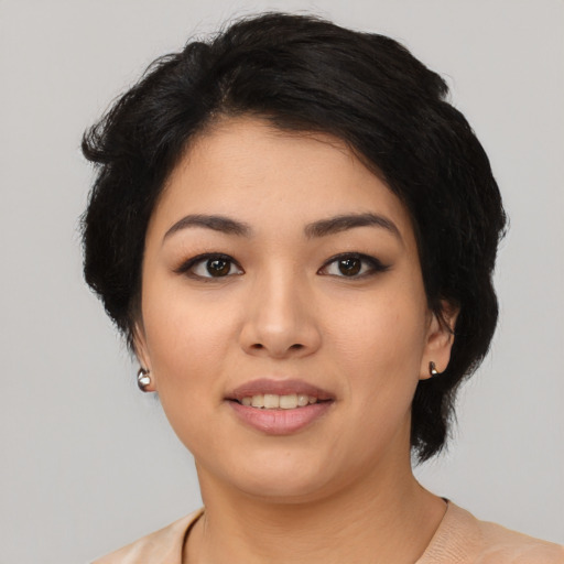 Joyful latino young-adult female with medium  black hair and brown eyes