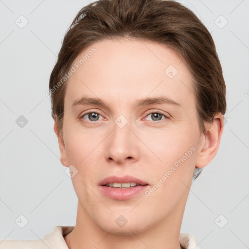 Joyful white young-adult female with short  brown hair and grey eyes