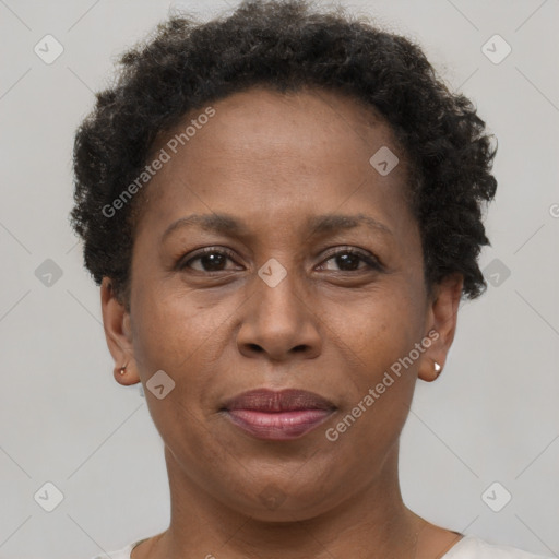 Joyful black adult female with short  brown hair and brown eyes