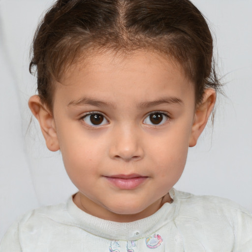 Joyful white child female with short  brown hair and brown eyes