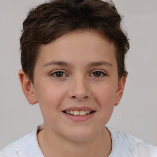 Joyful white child female with short  brown hair and brown eyes