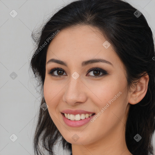 Joyful latino young-adult female with long  brown hair and brown eyes