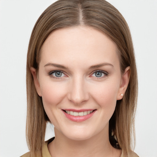 Joyful white young-adult female with long  brown hair and grey eyes